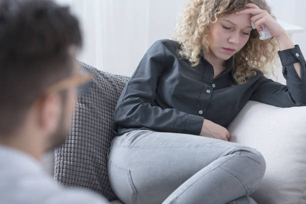 istock Sad woman holding a tissue 695799280