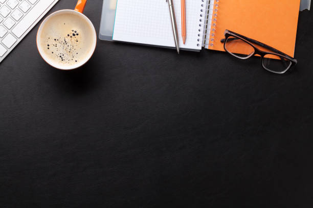 istock Office desk with coffee and supplies 695802300