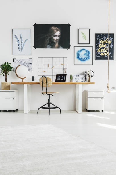 istock Home office with desk and posters 695802734