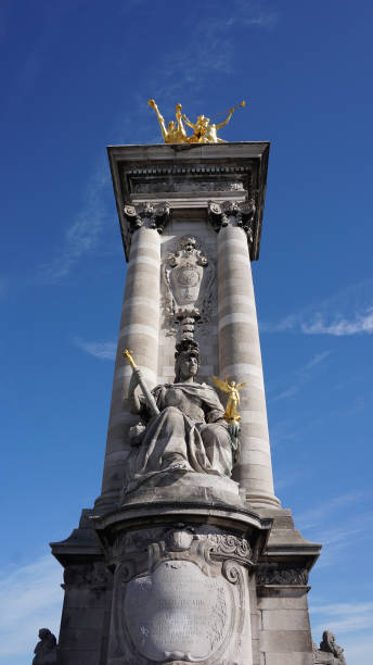 istock Photo from iconic Alexander III bridge the most beutiful in Paris on a spring morning, River Seine, France 695806702