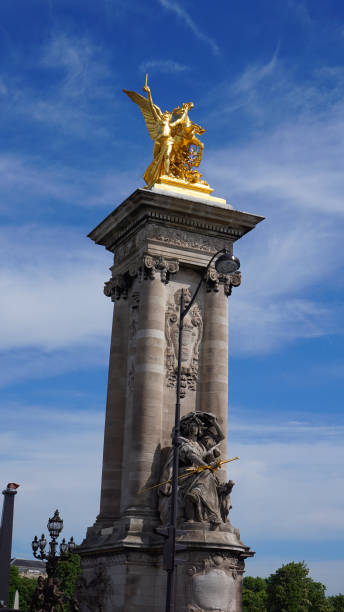 istock Photo from iconic Alexander III bridge the most beutiful in Paris on a spring morning, River Seine, France 695806834
