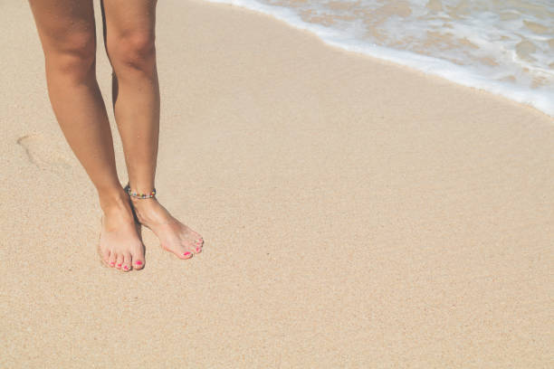 Woman standing on the tropical beach.