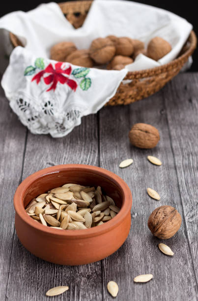 istock Pumkin seeds and walnuts 695812950
