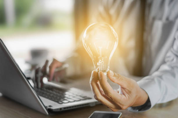 istock business man holding light bulb, concept idea with innovation and creativity 695813734