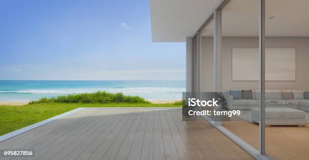 Sea View Living Room With Empty Terrace In Modern Luxury Beach House Vacation Home For Big Family Stock Photo - Download Image Now