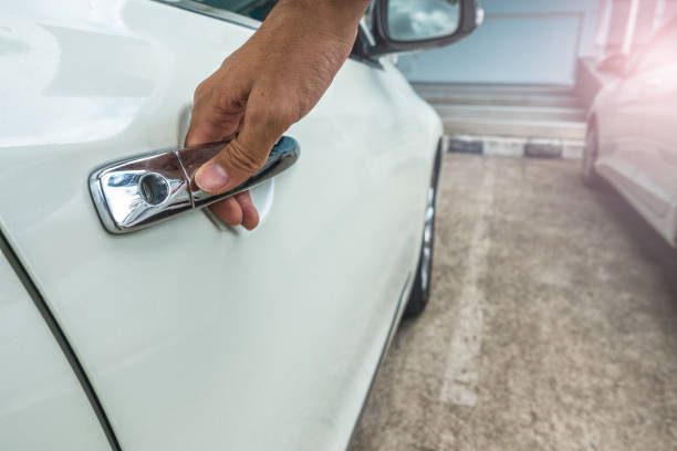 istock hand opening car door 695828592