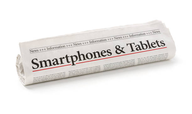 istock Rolled newspaper with the headline Smartphones and Tablets 695831698