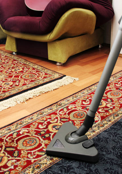 istock House cleaning with vacuum cleaner 695838988