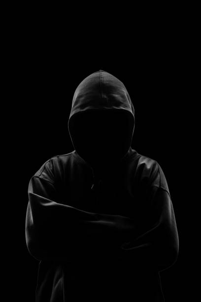 istock Silhouette of a hacker isloated on black background 695839544