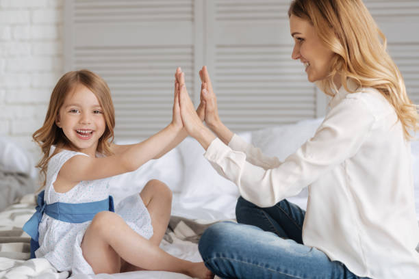 istock Gorgeous young mother holding hands with her daughter 695842750