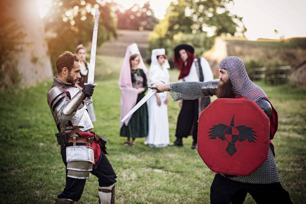 istock Medieval warriors exercising sword fight in village 695842860