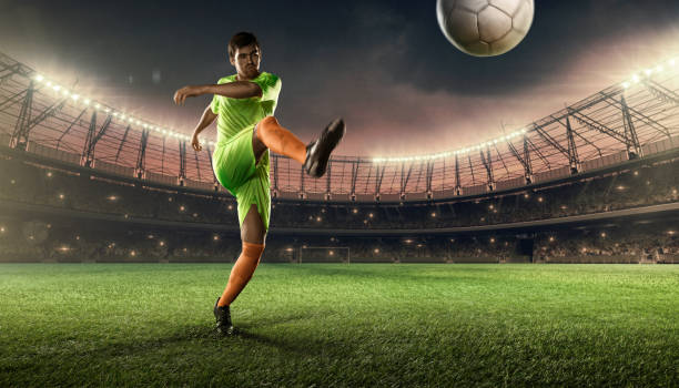 Soccer player kicking a ball on a playing field