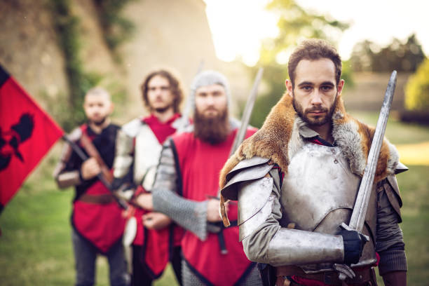 istock Young prince with sword and his soldiers 695843062