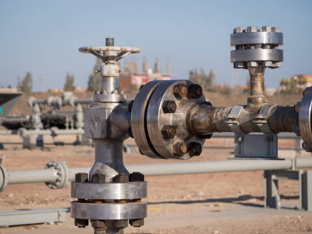 Choke Valve at Gas Well Head Choke Valve at Gas Well Head wellhead stock pictures, royalty-free photos & images