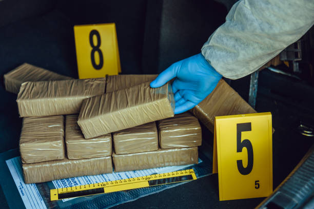 Drug smuggling Packages of narcotics in car trunk. Drug smuggling. cocaine stock pictures, royalty-free photos & images