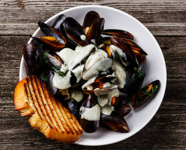istock Mussels Clams in Dor Blue cheese sauce 695847128