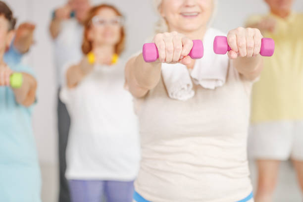 istock Exercising shoulders with dumbbells 695850900