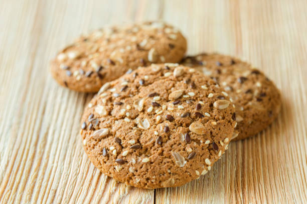 istock Few oatmeal cookies on a wooden table 695854004