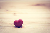 Red little heart on wood. Vintage concept of love, Valentine's Day