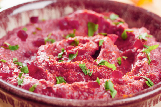istock Close Up of hummus with beetroot 695854910
