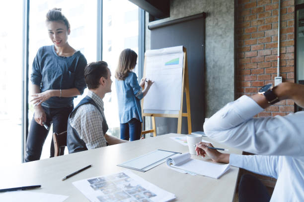 istock Group of colleagues having a brainstorming session at work 695858576