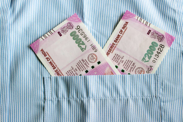 istock Indian currency in shirt's pocket. 695863342