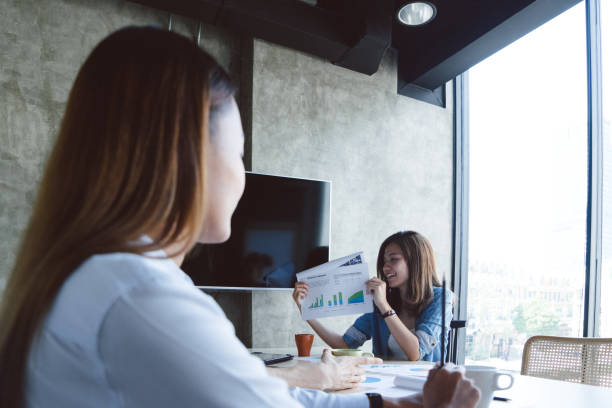 istock Coworkers having a meeting indoors 695863718