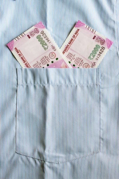 istock Indian currency in shirt's pocket. 695865930