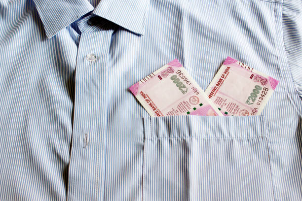 istock Indian currency in shirt's pocket. 695865962