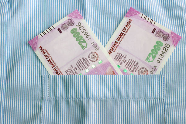 istock Indian currency in shirt's pocket. 695866186
