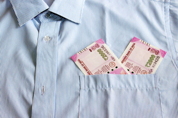 istock Indian currency in shirt's pocket. 695866212