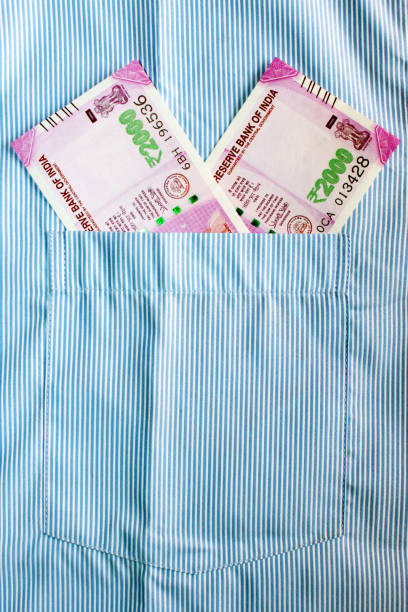 istock Indian currency in shirt's pocket. 695866576