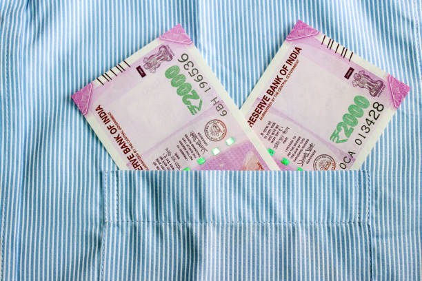 istock Indian currency in shirt's pocket. 695866586
