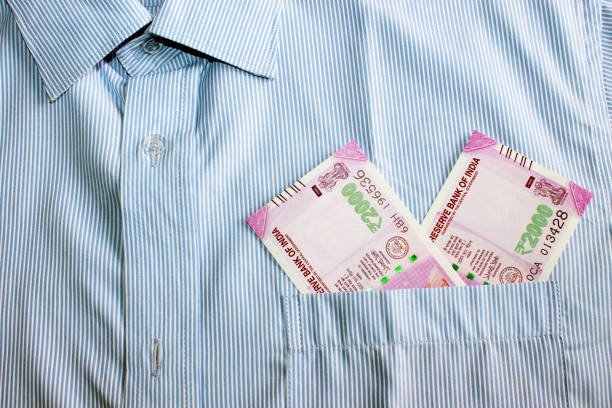 istock Indian currency in shirt's pocket. 695867140
