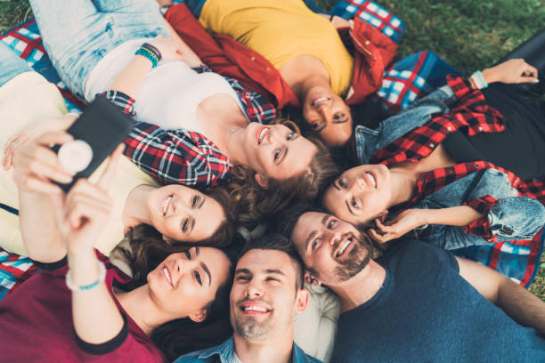 istock Friends taking selfie in the park 695869654