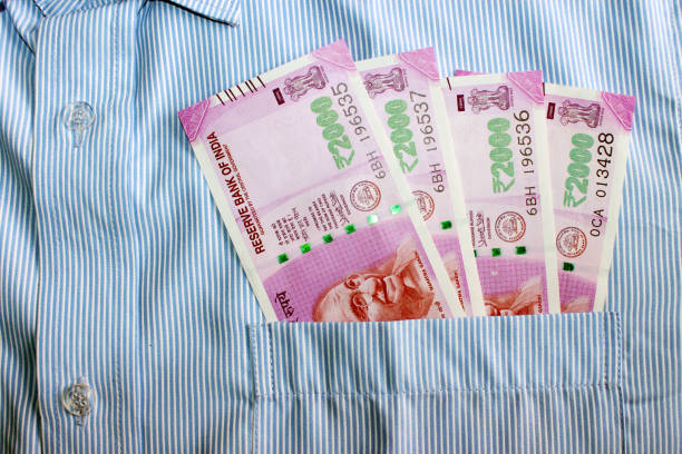 istock Indian currency in shirt's pocket. 695870152