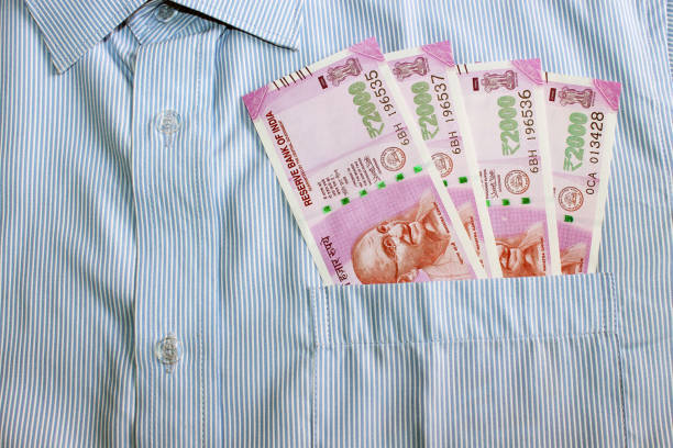 istock Indian currency in shirt's pocket. 695870206
