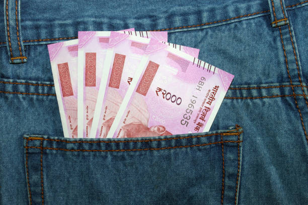 istock Indian currency in a man's jean back pocket. 695870248