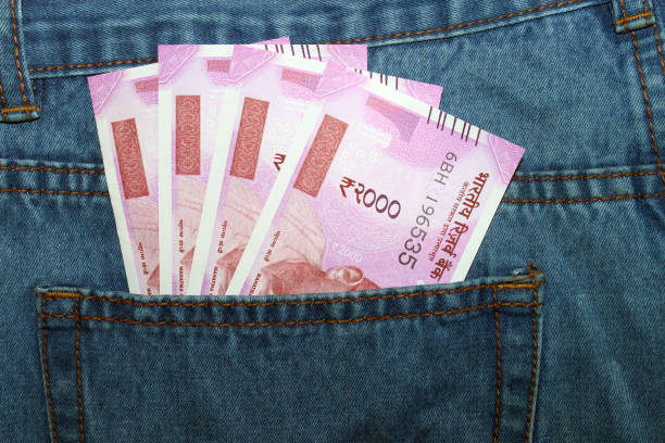 istock Indian currency in a man's jean back pocket. 695873428