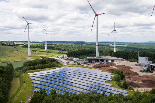 Wind turbine park and solar collectors - aerial view