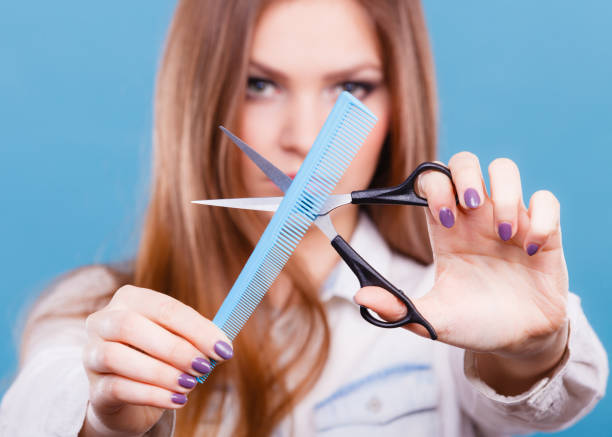 istock Female hairdresser presenting tools. 695877780