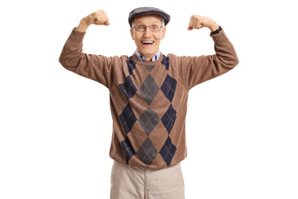 istock Cheerful senior flexing his muscles 695882294