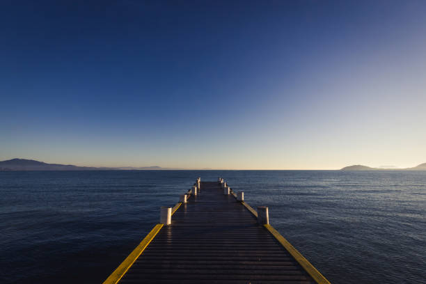 Early morning at a wooden pier in Canasvieiras in the city of Florianopolis, on the state of Santa Catarina, Brazil.