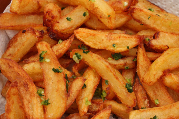 istock Fried potatoes - Garlic and parsley chopped 695885804