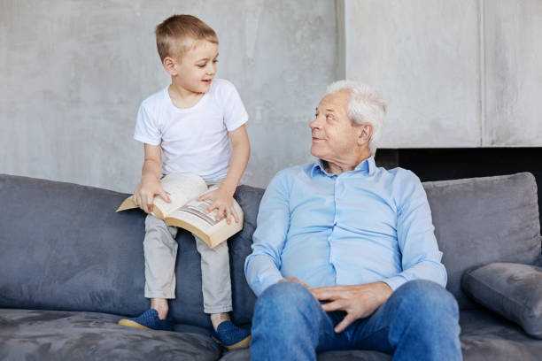 istock Committed kid and his grandparent having a pleasant conversation 695893170