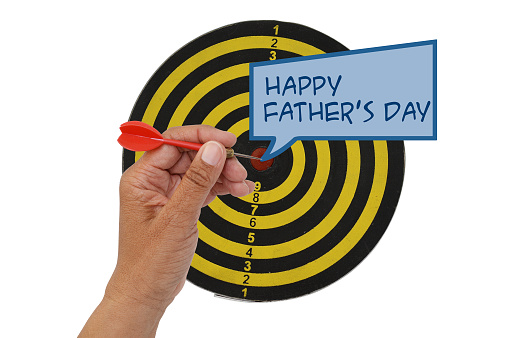 Happy Father's day comment box hand with dart in bulls eye dartboard isolated on white background