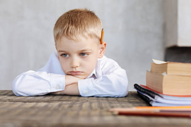 istock Sad sincere boy being a stubborn student 695894192