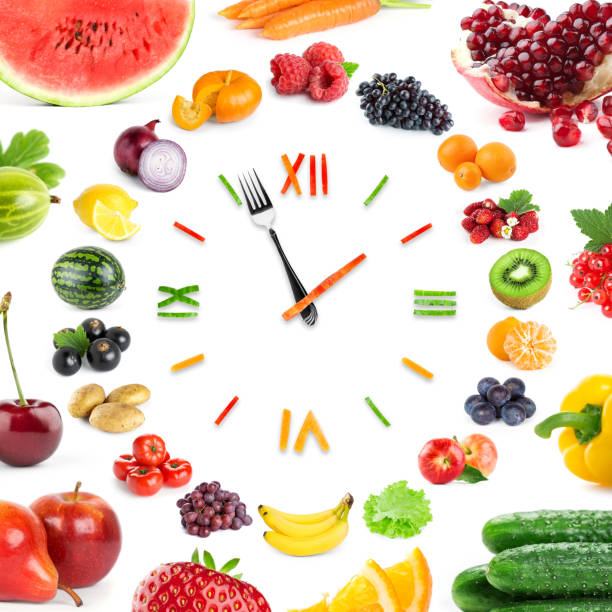 istock Food clock with fruits and vegetables 695896792