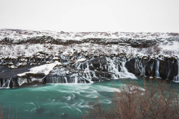 Hraunfossar waterfall in winter iceland Hraunfossar waterfall in winter iceland hraunfossar stock pictures, royalty-free photos & images