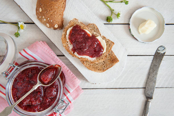 strawberry jam and bread - butter toast bread breakfast imagens e fotografias de stock